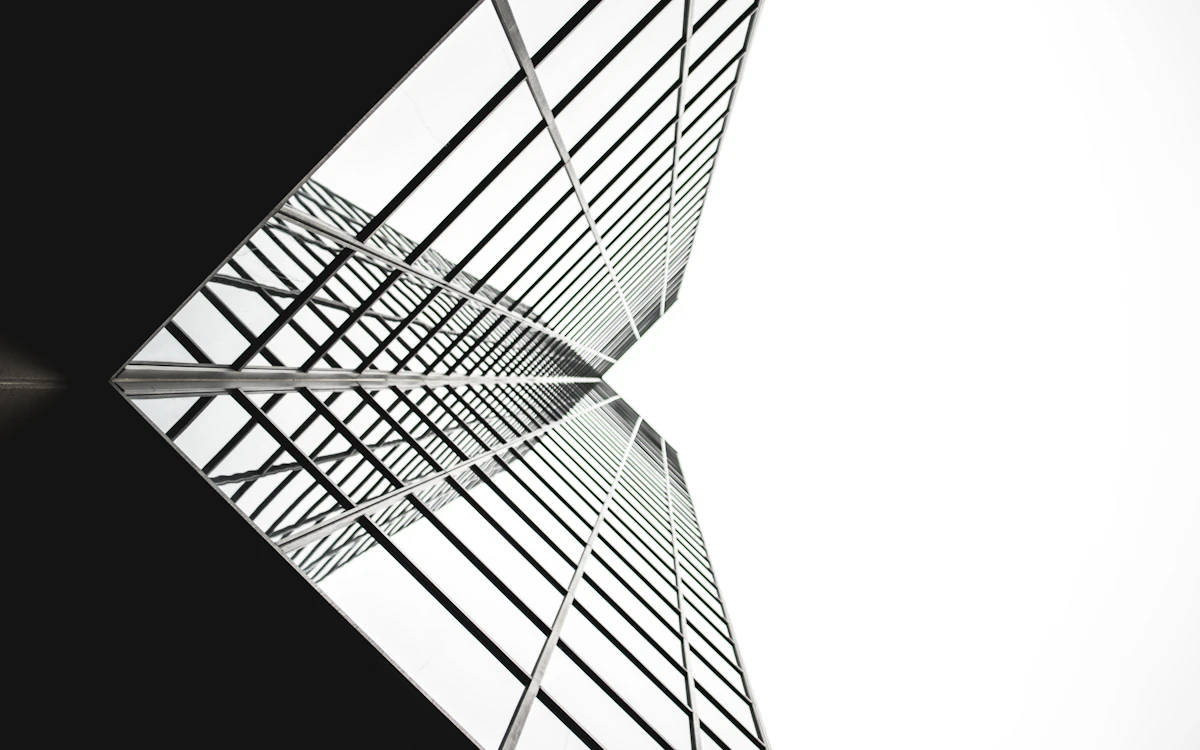 low angle photo of mirror glass building