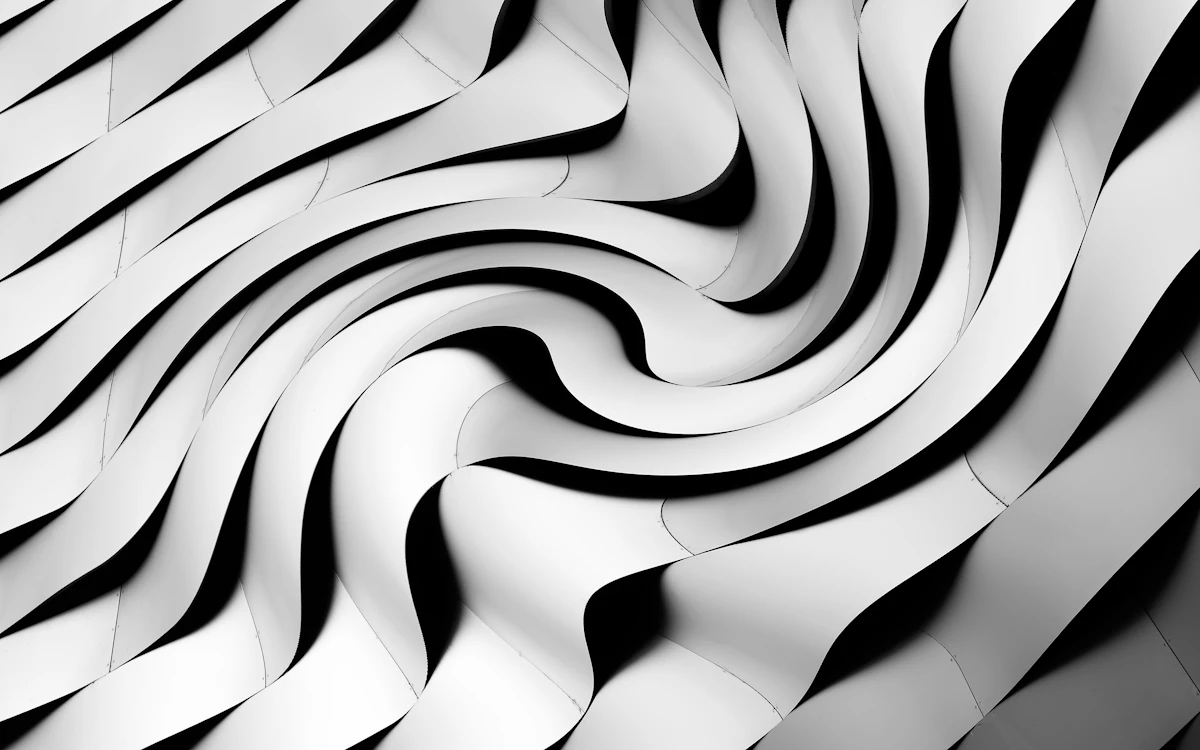 a black and white photo of a wavy pattern