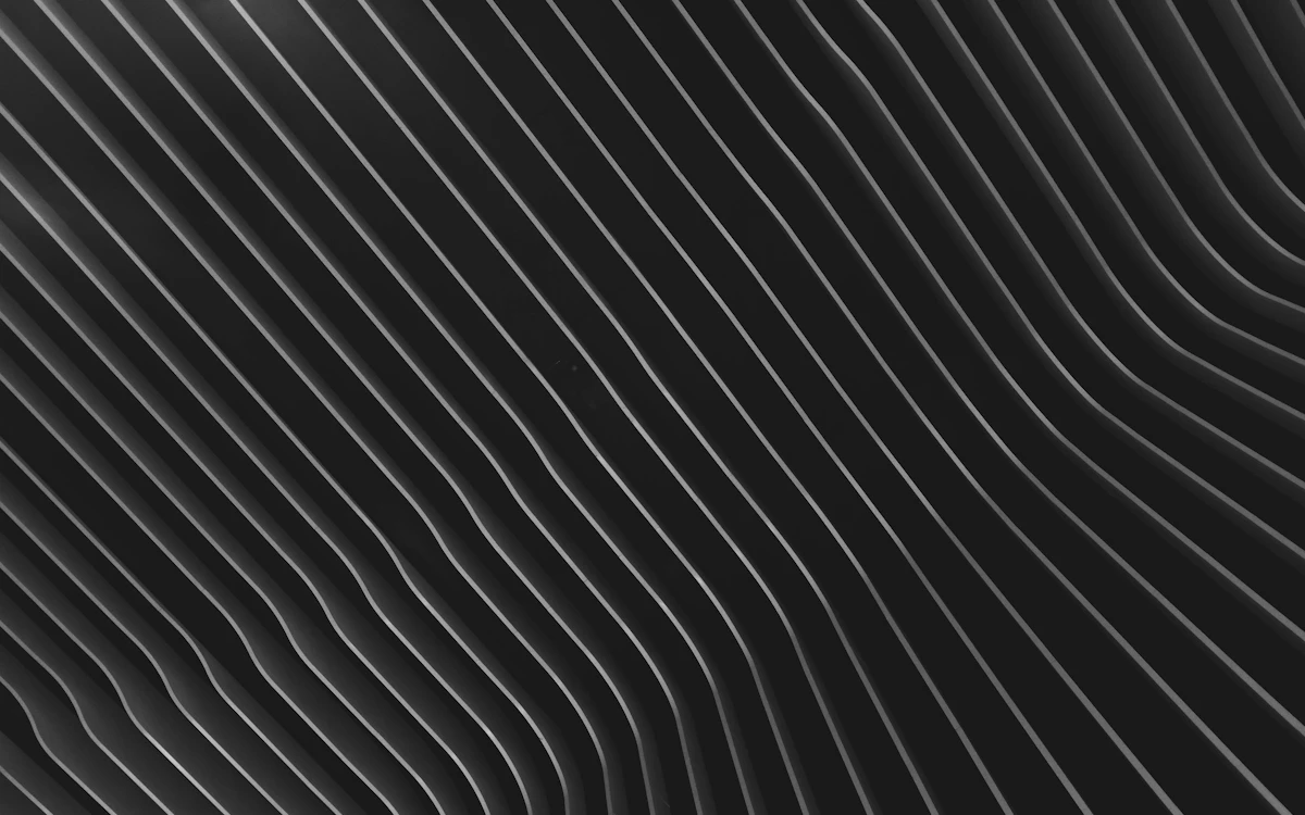a black and white abstract background with wavy lines