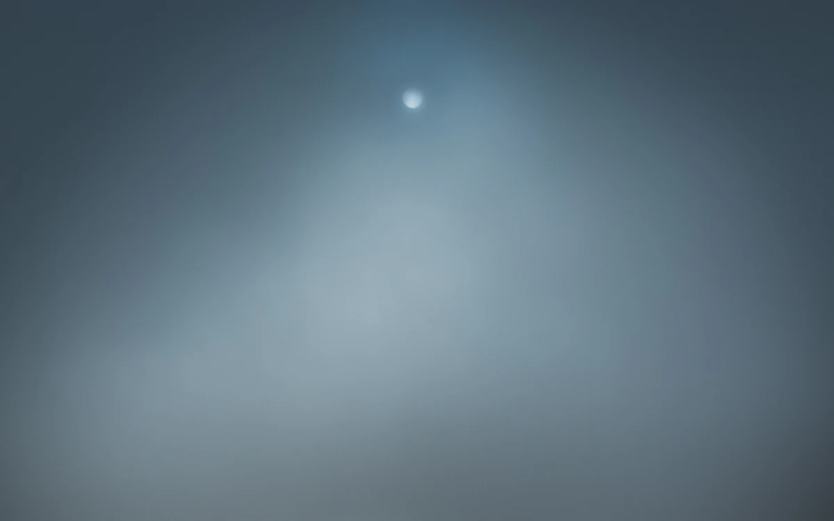 full moon lighted body of water