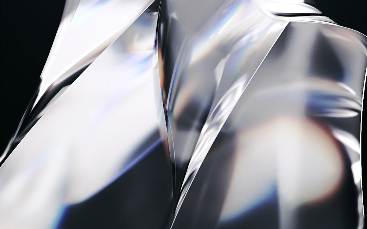 a shiny silver object with a black background