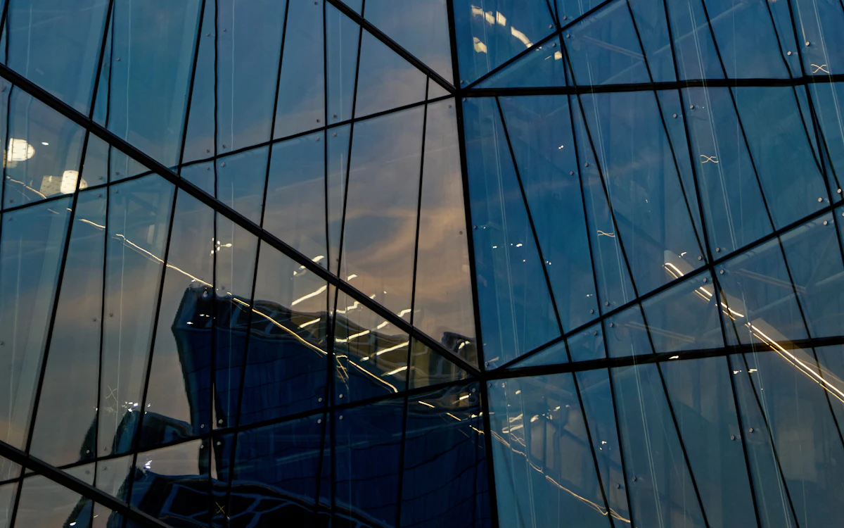 The reflection of a building in the windows of another building