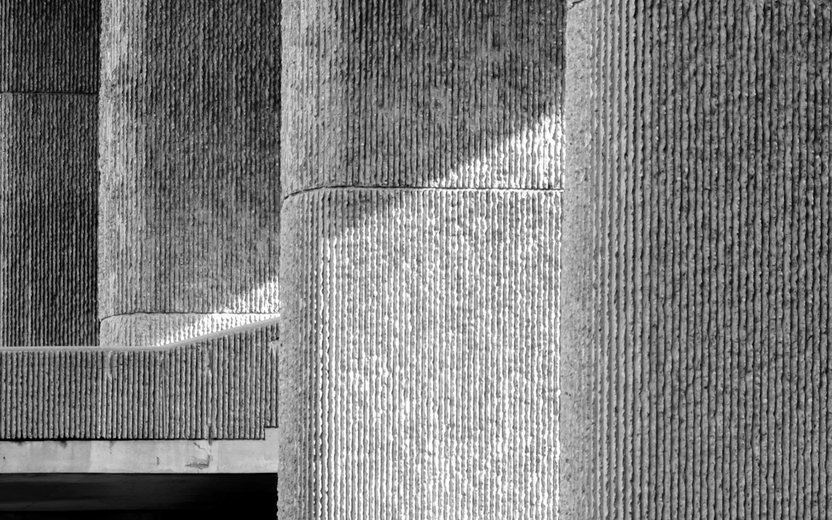 grayscale photo of concrete wall