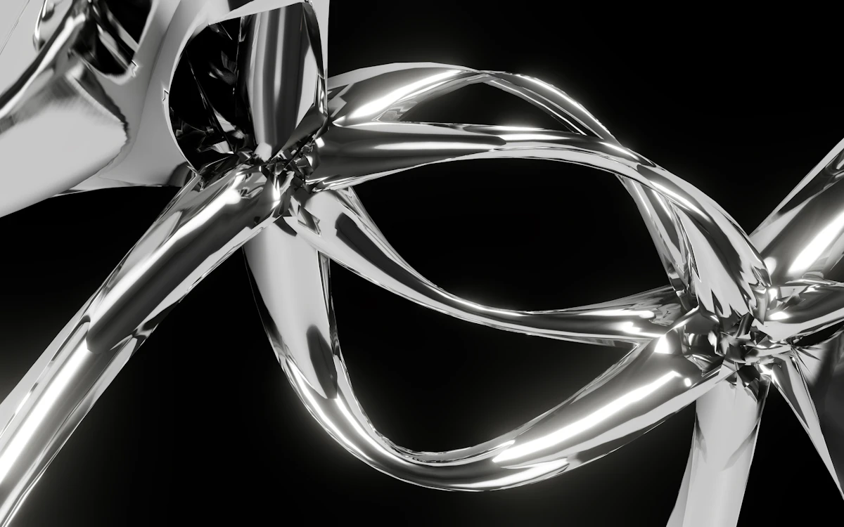 A close up of a metal object on a black background
